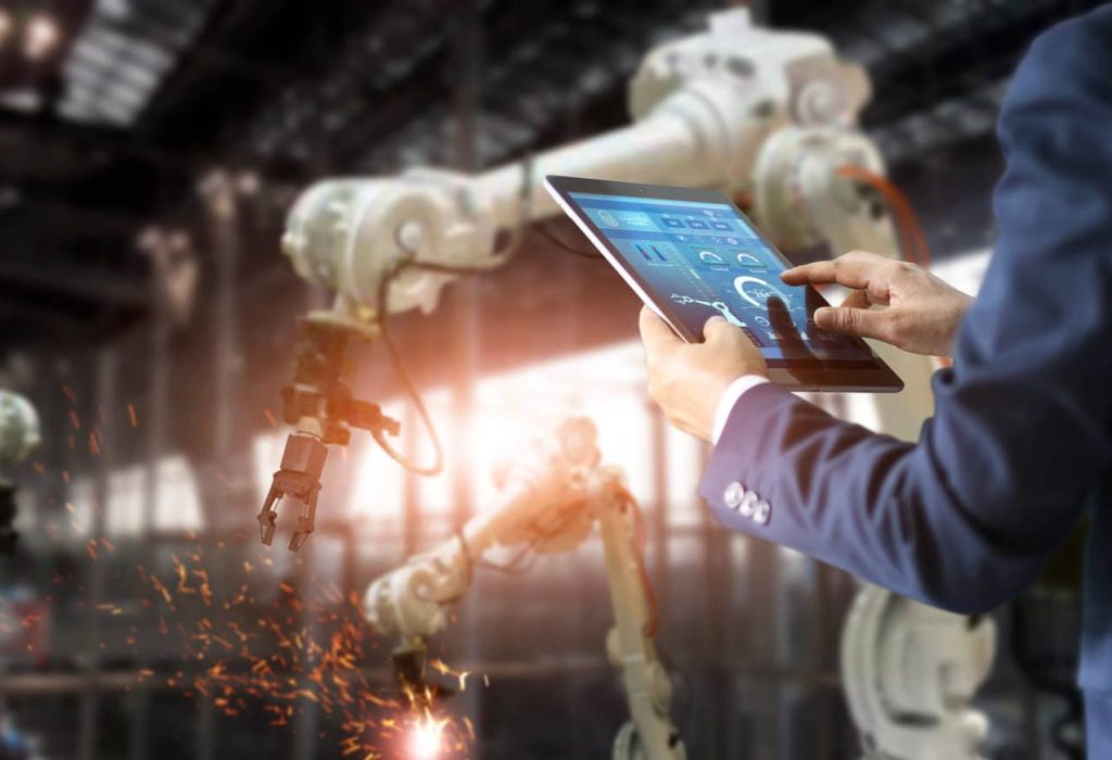 manager-industrial-engineer-using-tablet-check-control-automation-robot-arms-machine (1)